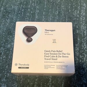 Therabody Theragun Mini - Cream Packaging with Black Device Image